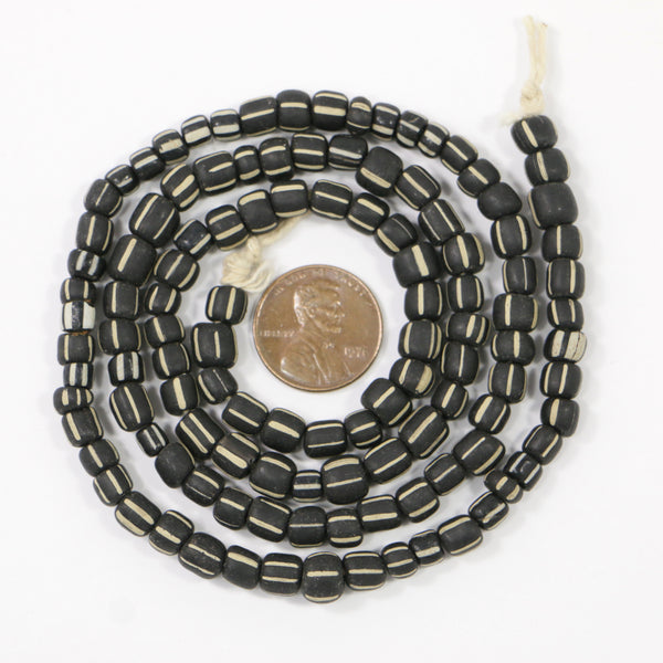Indonesia, Small Matte Black with White Striprd, 5-6mm on 23-inch Strands