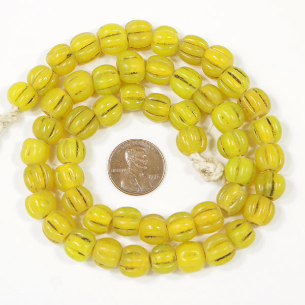 Indonesia, Melon Beads, Yellow Antiqued, Semi-Opaque Moon Glass 9mm, 19-inch Strand
