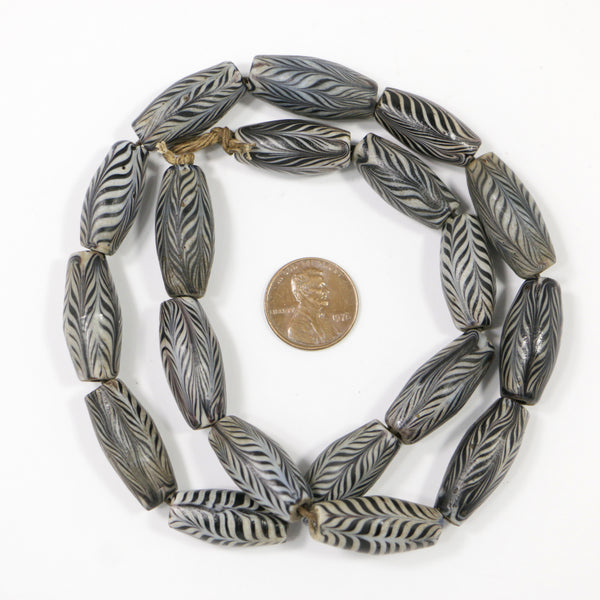 Indonesia, Oval Black and White Finely Detailed Feathered Beads, 25x10mm, 19-inch Strand