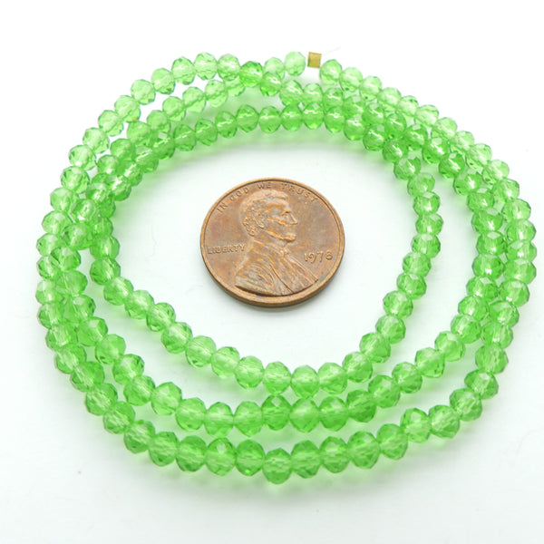 Faceted Glass, "Dragon Crystal" 3x4mm Translucent Green on long 18-inch Strands