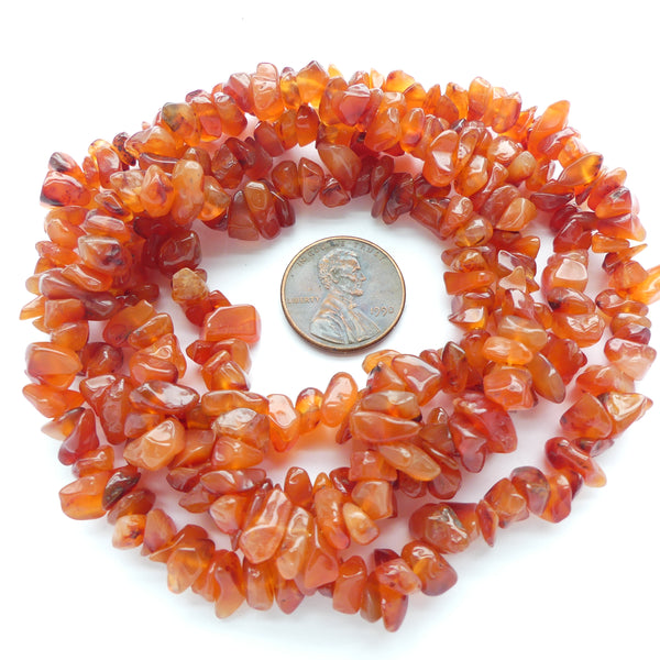 Carnelian, Chips, Largest 12mm on 34-inch Strands