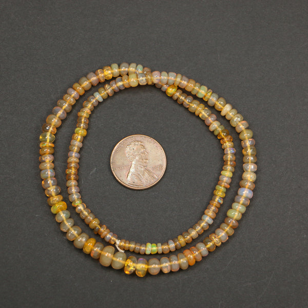 Opal, Ethiopian, Rondelles Amber Color Graduated 2x3mm to 4x5mm on 16-inch Strand