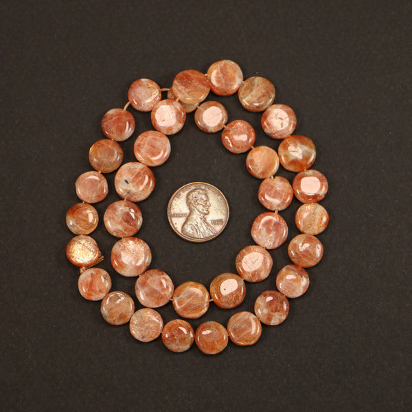 Sunstone, Coin Shape, Slightly Graduated Sizes from 10-12mm Diameter on 16-inch Strand