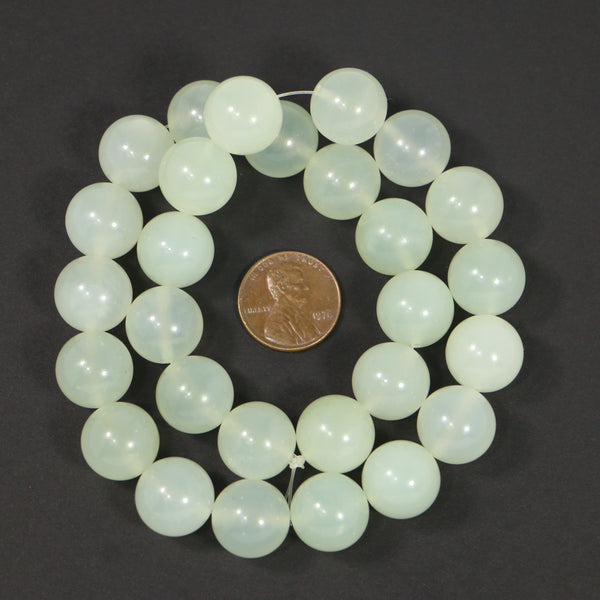 New Jade, Round, 14mm Diameter Light Translucent Green, on 16-inch Strands