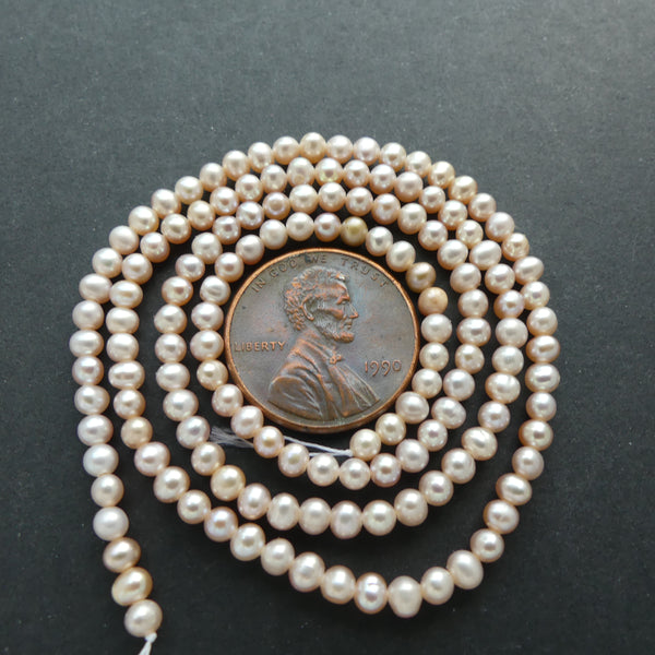 Pearls, Pink, Oblate Shape, 2x3mm on 16-inch Strand