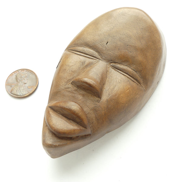 Wood, Carved Face, 4.5 inches Long by 2.5 inches Wide