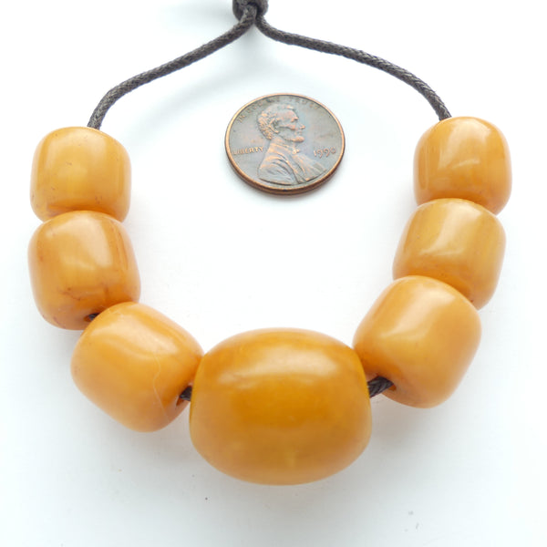 Resin, One Vintage Amber Bead and 6 Reproductions. Largest Bead 20x17mm, Set of 7