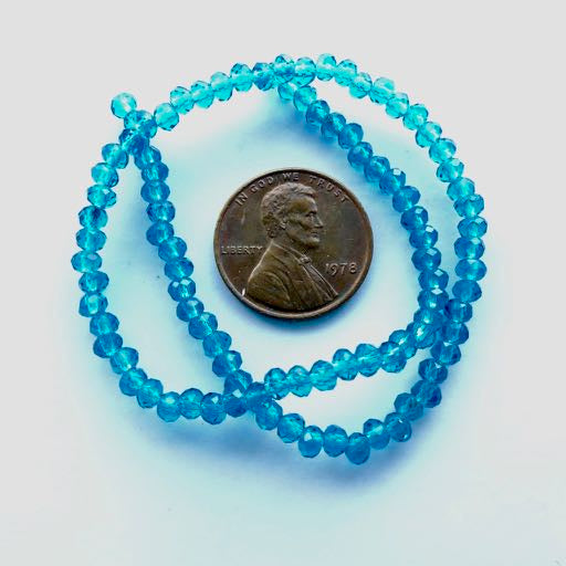 Faceted Glass "Dragon Crystal" 2x3mm, Translucent Aqua, 9.5-inch Strands