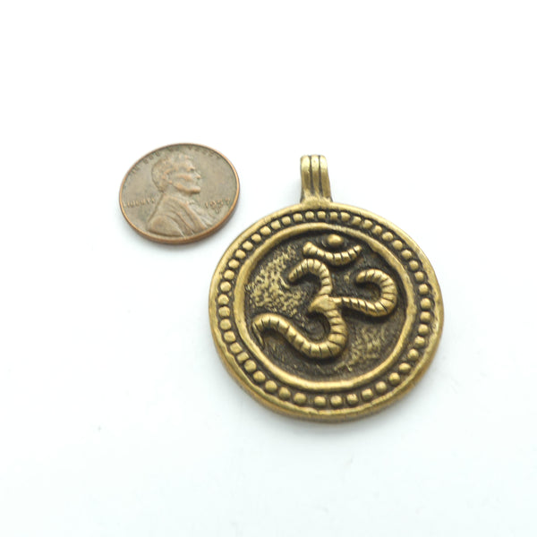 Pendant, Brass, Round with Om Symbol, 33mm Diameter with Loop at Top