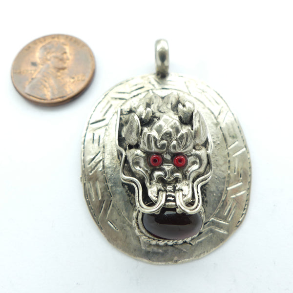 Himalayan Dragon Pendant, Silver Oval with Raised Dragon Face & Stones, 33x44mm