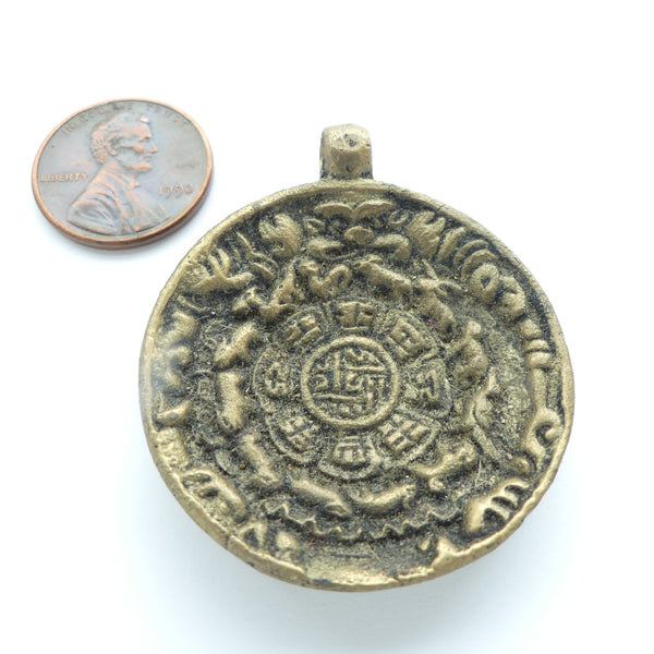 Tibetan Melong Amulet, Brass with Auspicious Symbols, 38mm Diameter