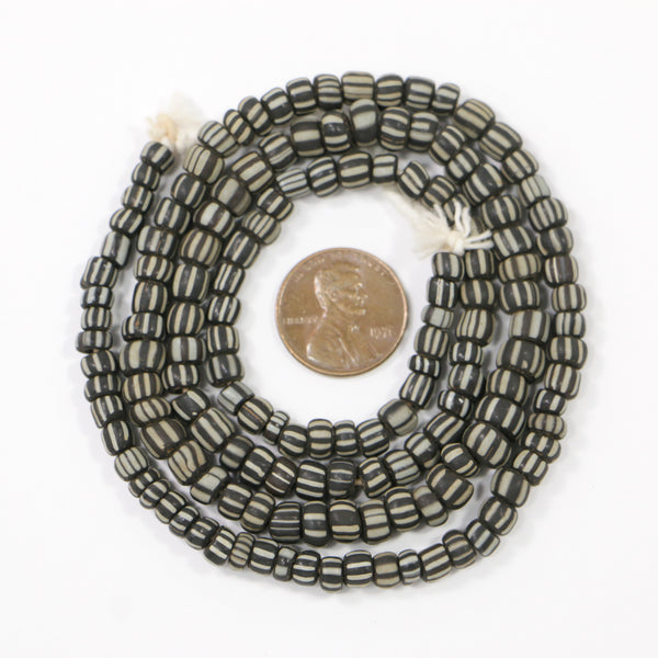 Indonesia, Small Black Matte Spacer Beads with White Stripes, 4-5mm on 23-inch strands
