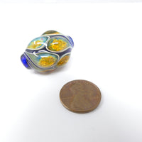 Tom Boylan Bead, Small, but Special with Blue and Gold "Eyes" 30x20mm