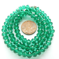 Faceted Glass, "Dragon Crystal" 5x6mm Translucent Emerald on 16-inch Strands