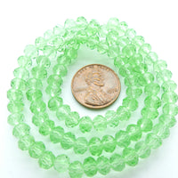 Faceted Glass, "Dragon Crystal" 4x6mm Light Translucent Green on 16-inch Strands