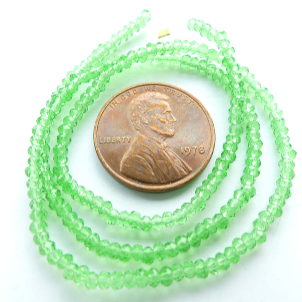 Faceted Glass, "Dragon Crystal" 1x2mm Translucent Green on 12-inch Strands