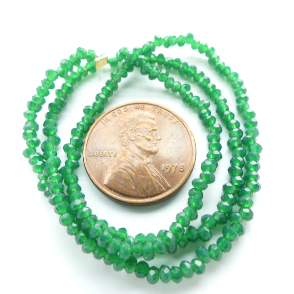 Faceted Glass, "Dragon Crystal" 1x2mm Semi-Translucent Emerald on 12-inch Strands