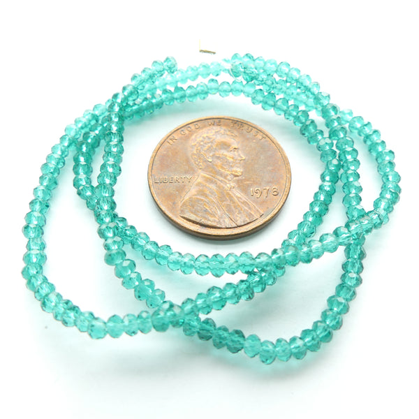 Faceted Glass, "Dragon Crystal" 1x2mm Translucent Emerald on 12-inch Strands