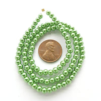 Glass Pearls, Round Medium Green Luster, 4mm on 16-inch Strands