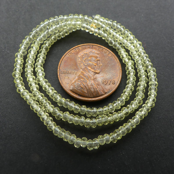 Facted Glasss, "Dragon Crystal" 1x2mm Translucent Light Yellow on 12-inch Strands
