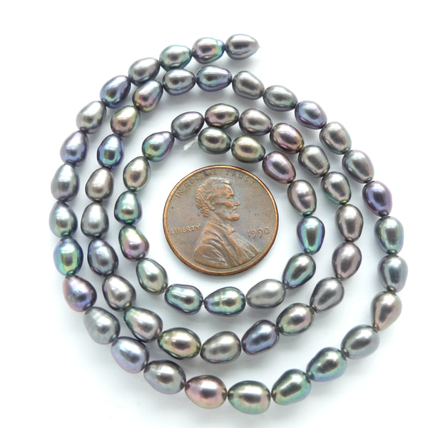 Pearls, Peacock, Oval Darker Grey with Purple Highlights 6x5mm on 16-inch strands
