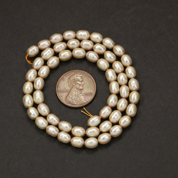 Pearl, Champagne Ovals 6x5mm on 16-inch Strand