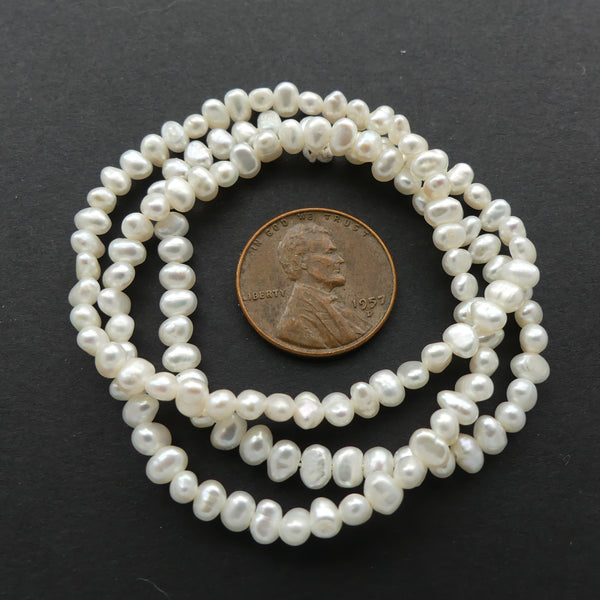 Pearls, White, Button Shape, 2x3mm on 16-inch Strands