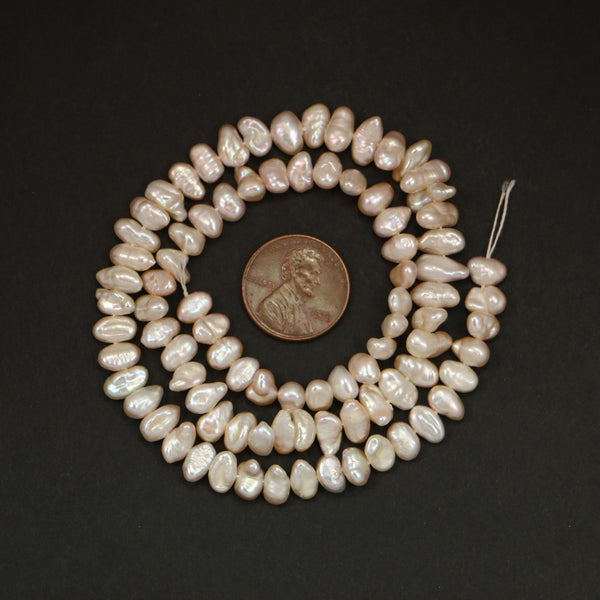 Pearls, Pink, Button Shape 4x6mm on 16-inch Strand
