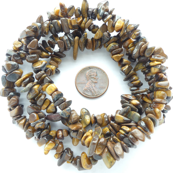 Tiger Eye, Chips Largest 12mm on 34-inch Strands