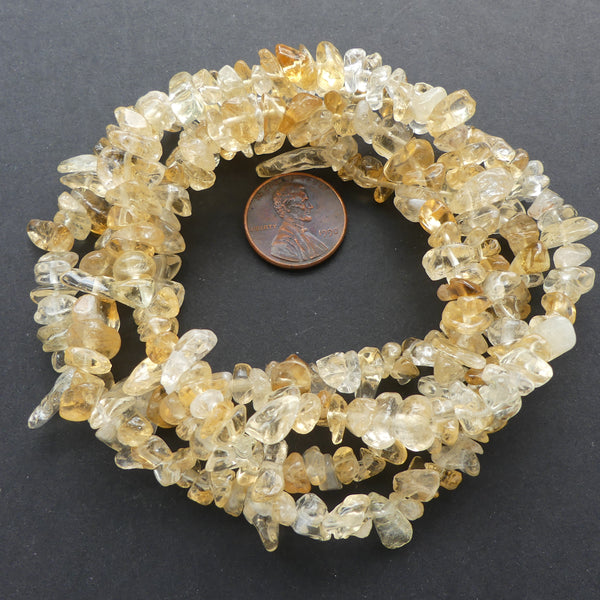 Citrine, Chips Varied Largest 15mm on 34-inch Strand