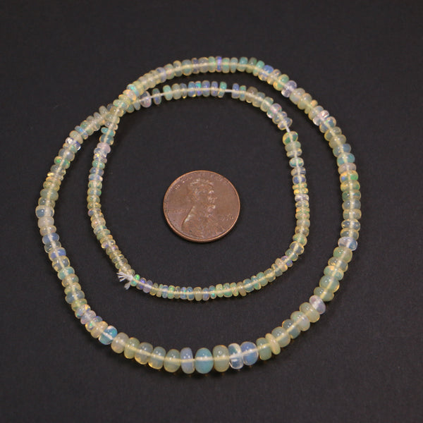 Opals, Ethiopian, Rondelles, Light Yellow, Graduated 1x2mm to 4x6mm on 16-inch Strands