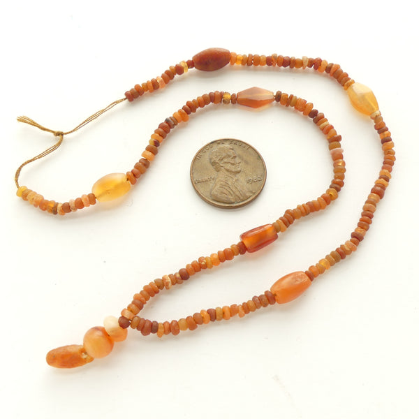 Ancient, Bactrian Carnelian Beads from Afghanistan, 15-inch strand with Small Pendant
