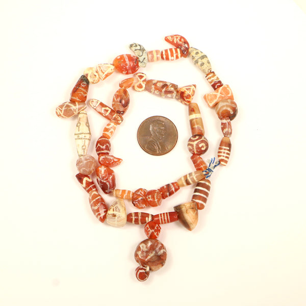 Ancient Bactrian Bronze Age Carnelian, Assorted Etched Shapes on 18-inch Strand