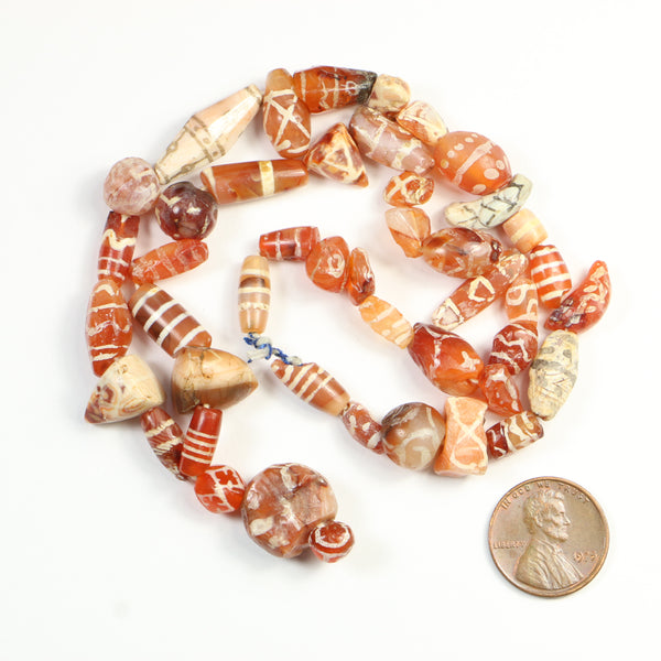 Ancient Bactrian Bronze Age Carnelian, Assorted Etched Shapes on 18-inch Strand
