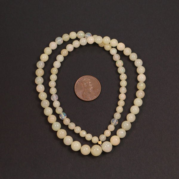 Opals, Ethiopian, Round, Pale Yellow Graduated 4-7mm on 16-inch Strand