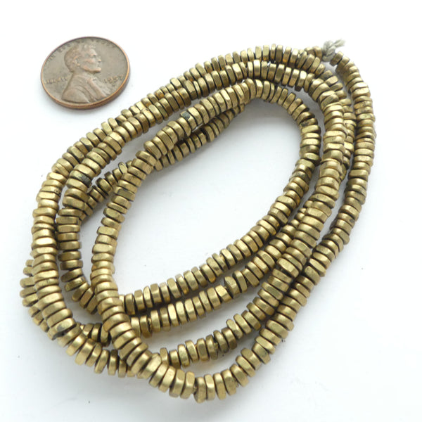 Brass, Small Irregular Slices 3-4mm Diameter, 1-2mm Thick on 25-inch Strand