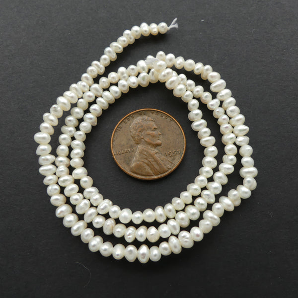 Pearls, White, Oval Shape, 2x4mm on 16-inch Strand