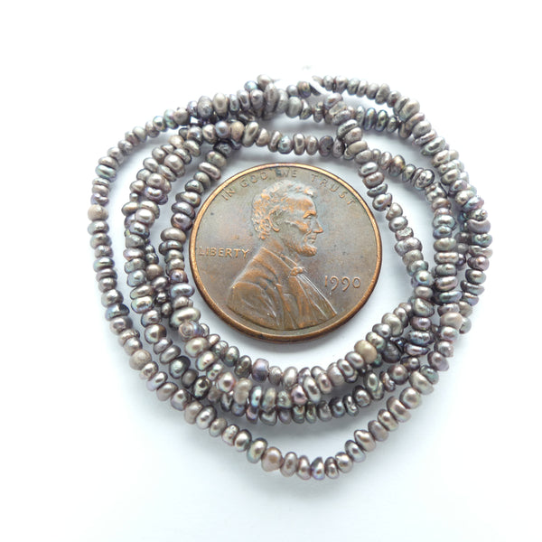 Pearls, Peacock, Tiny Irregular Button Shape, 1x2mm on 16-inch Strand