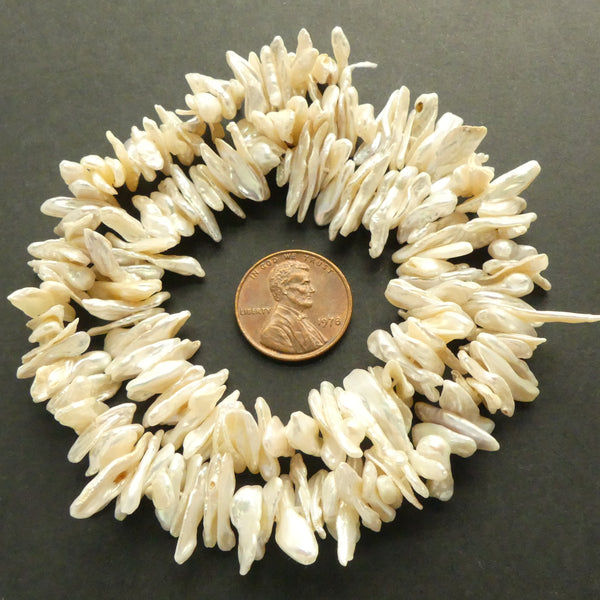 Pearls, Cream Keshi  "Chips" 8x12mm long on 16-inch Strand