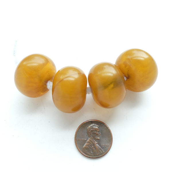 African Amber, Small Honey Colored Oblates with Single Hole, 24mm Diameter, Sold Individually