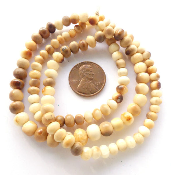Bone, Mammoth Tusk Vintage Rondells, 2x3 to 4x7mm on 20-inch Graduated Strand