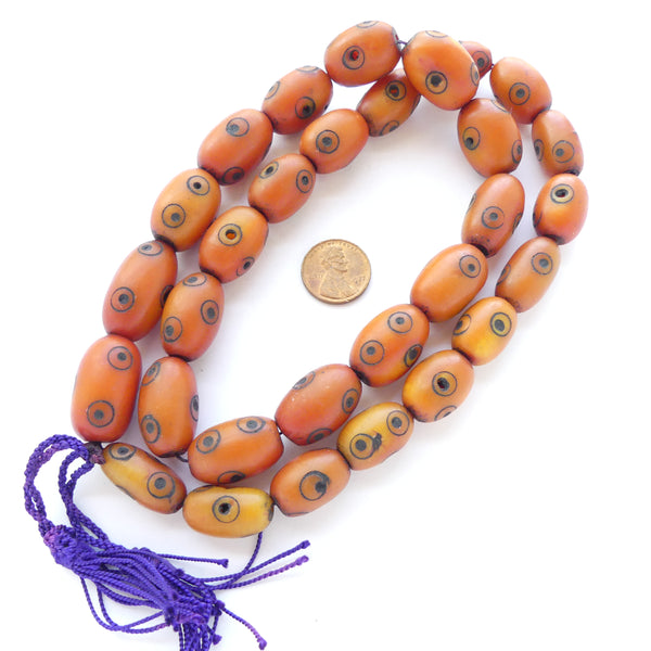 Berber Amber, Strand of 30 Oval Beads with Circle/Dot Eye Deisgn