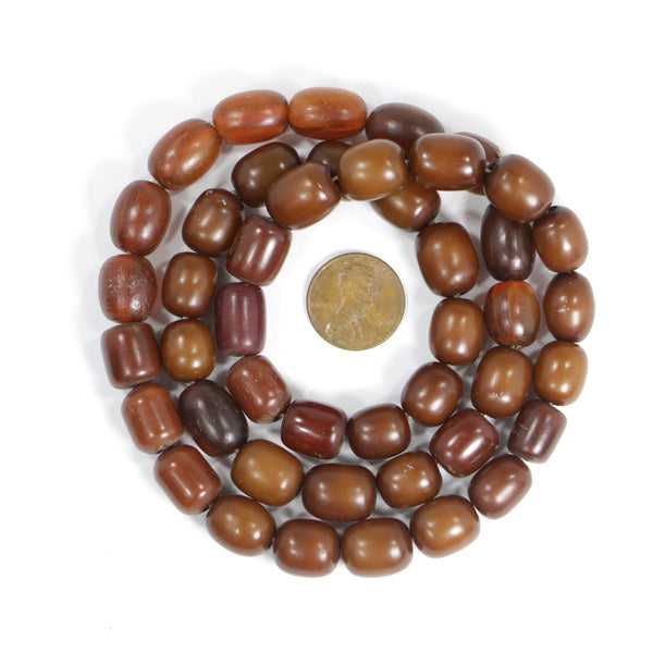 Resin, Brown With Red Undertones, Ovals & Barrels, 12 to 14mm long, on Long 24-inch Strand