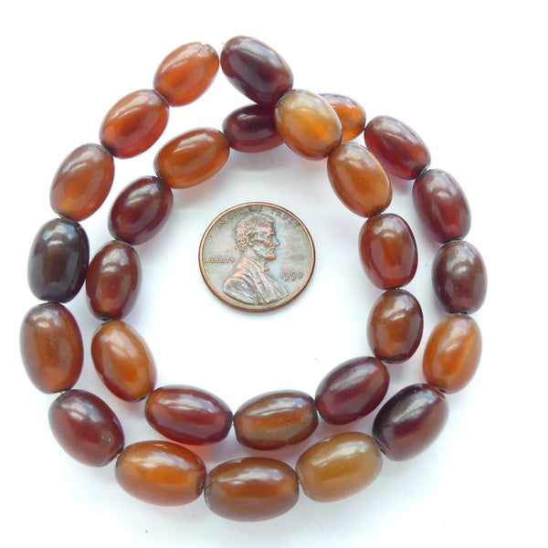 Resin, or Horn? in a Range of Warm Semi-Translucent Browns, Ovals 10x8mm on 14-inch Strand