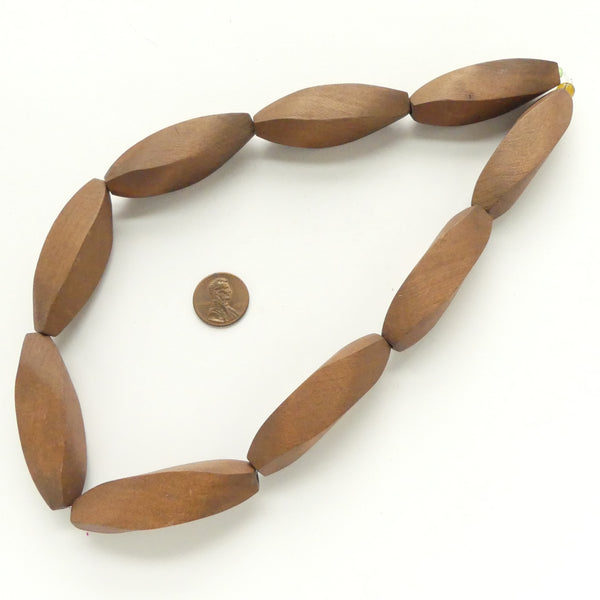 Wood, Twisted "Faceted" Ovals, 55x15mm on 17-inch Strands