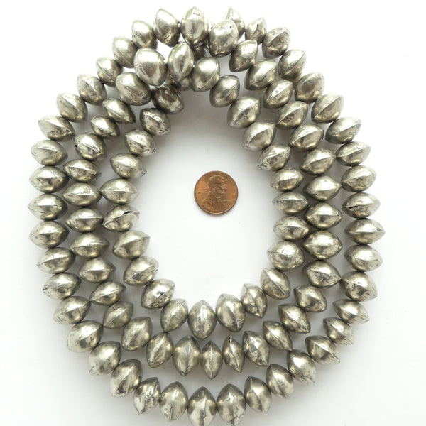 Silver (White Metal) Hollow Bicones From Mali 10x15mm, Sold by the Strand