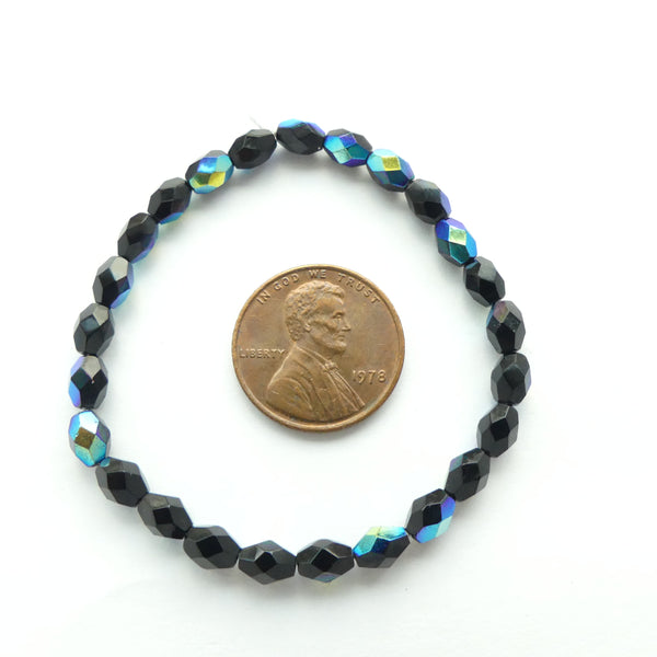 Czech Molded Glass Faceted Ovals 6x4mm, Black AB, Strands of 50