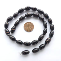 Indian Wound Glass, Oval, 13x7mm, Black with Aventurine Feathering,
