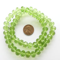 Faceted Glass, "Dragon Crystal" 8x10mm, Green Light Translucent