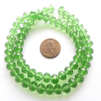 Faceted Glass "Dragon Crystal" 6x8mm, Green, Medium Translucent, 16" Strands